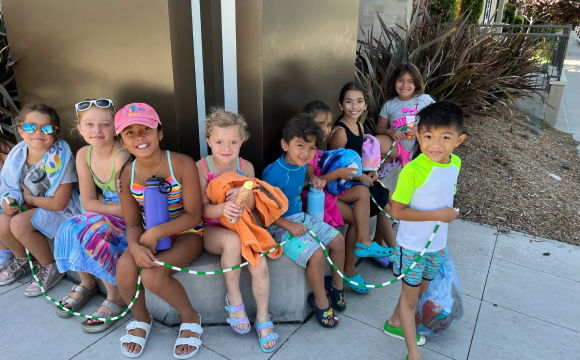 A group of kids posing together during camp