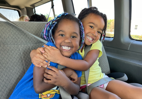 Two girls in a SD Gym transport on their way to the after school program