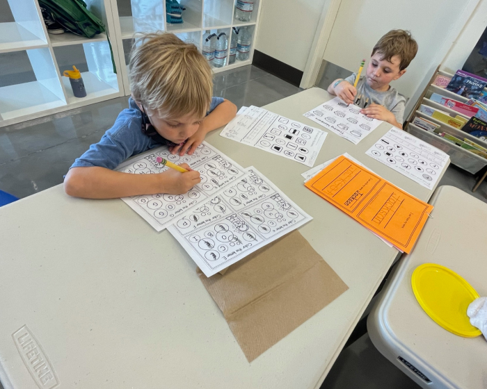 Two kids doing homework together