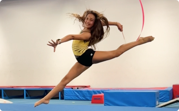 A girl mid air landing a jump