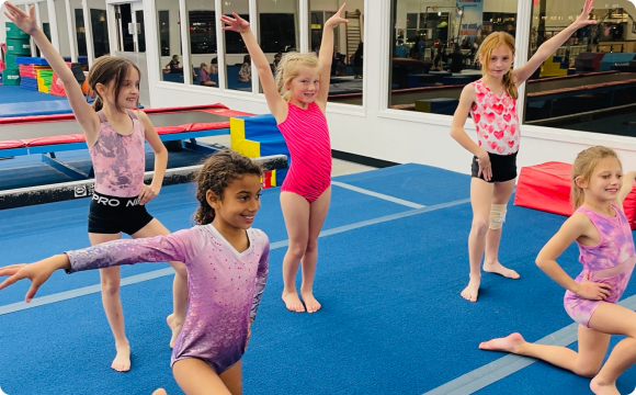 A group of girls holding stances together